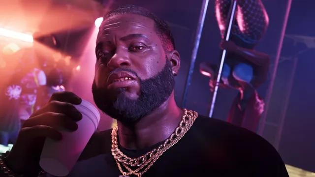 Close-up of Boobie in the neon light of his club
