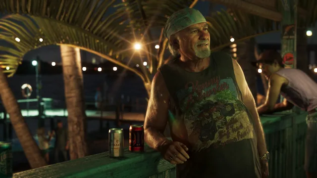 Brian leaning against a railing with two cans