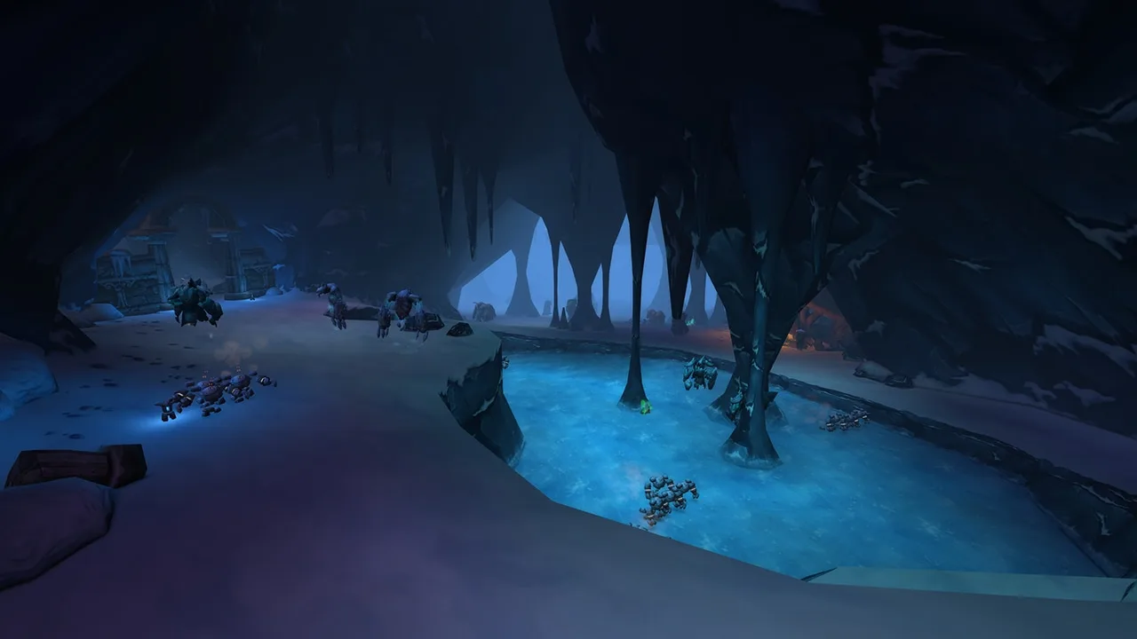 Underground cavern with glowing blue water inside the Barrow Deeps raid in World of Warcraft: Forever