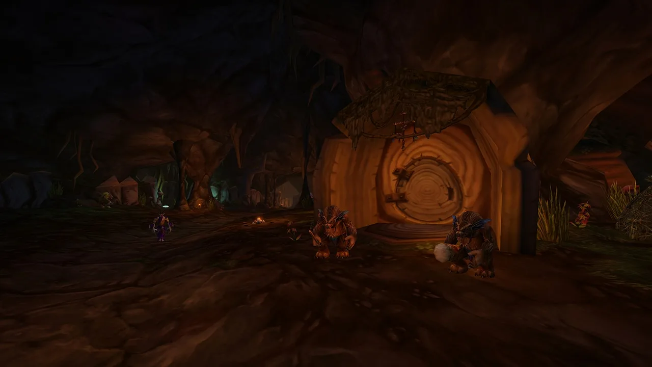 Dark underground passage with buildings carved into the rock in Barrow Deeps, World of Warcraft: Forever