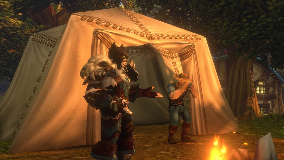Two players in front of a large Camp Tent next to the campfire in World of Warcraft: Forever